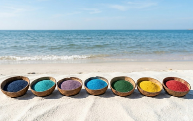 Bowls of colored sand on the beach